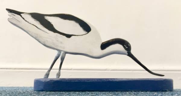 - a , wood Sculpture by John Comley, measuring 20 x 40 cm (H x W) £200